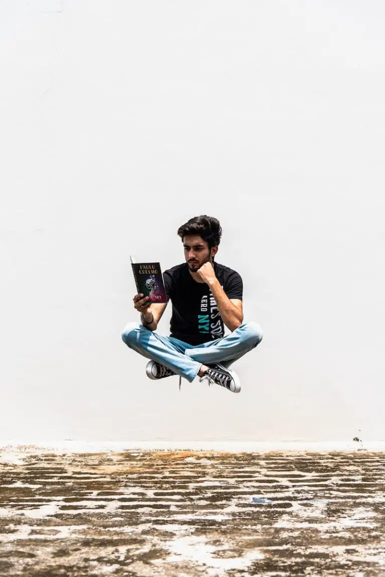 man floating in the air, siting while reading